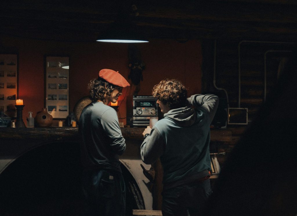 a couple of men standing next to each other